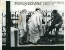 1960 Media Photo man and veiled Moslem women trample man at Place du Gouvernment